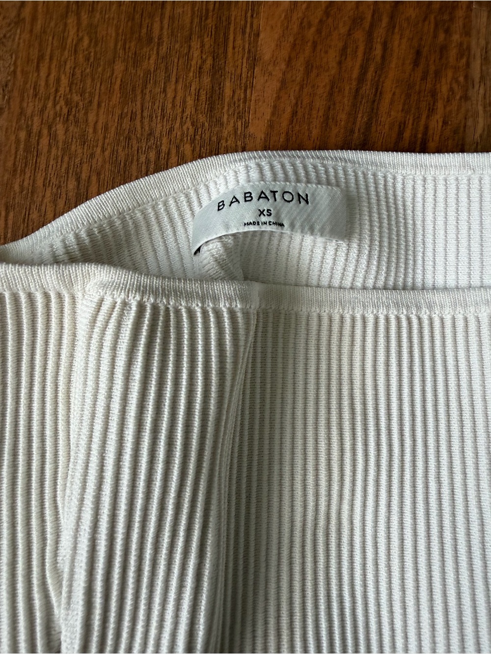 Babaton Off-the-Shoulder Ribbed Sweater in White